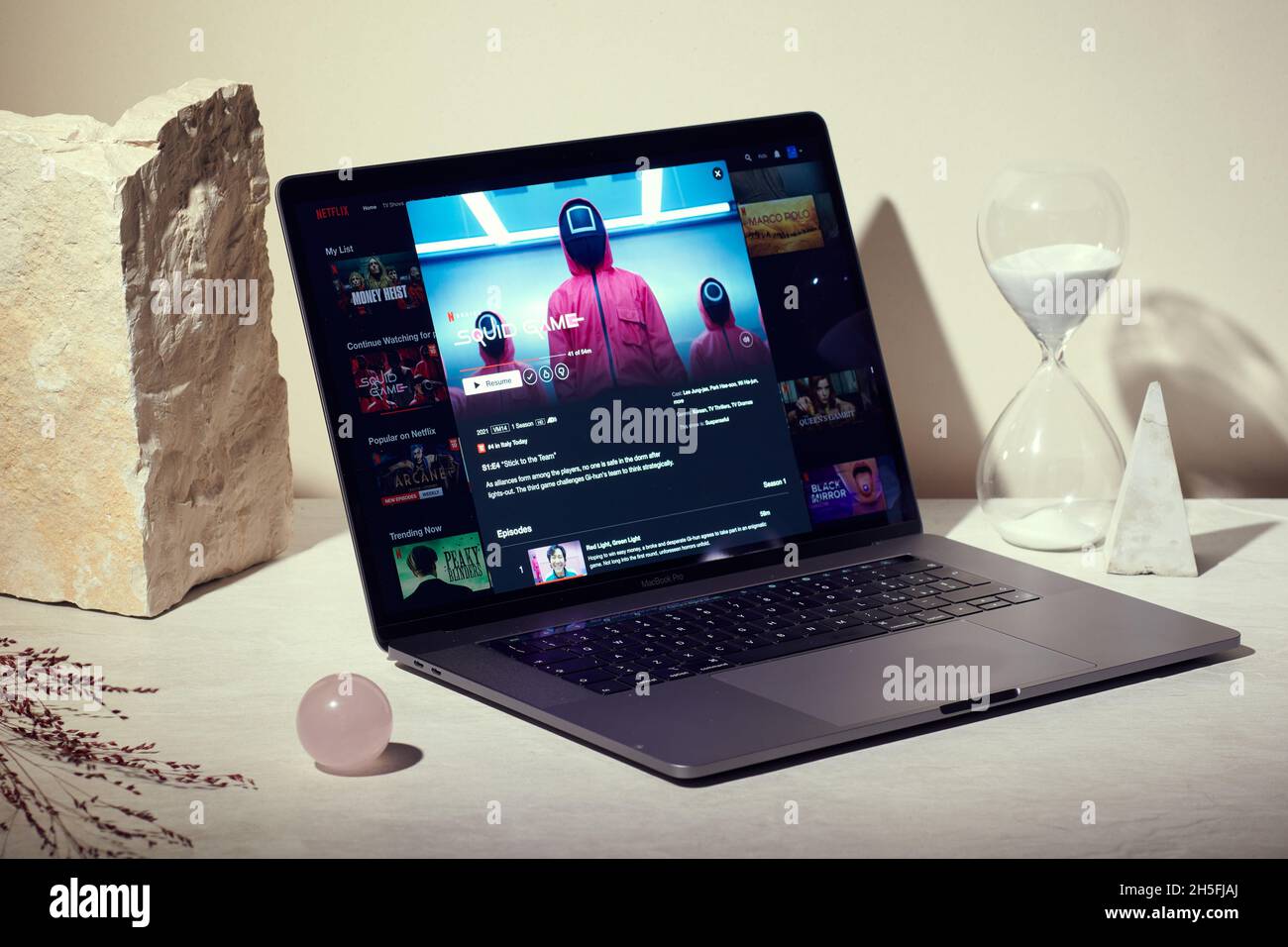 Milan, Italy - November  09, 2021: Squid Game Netflix series on laptop screen, creative interpretation. Moody and unique image from Netflix website. Stock Photo