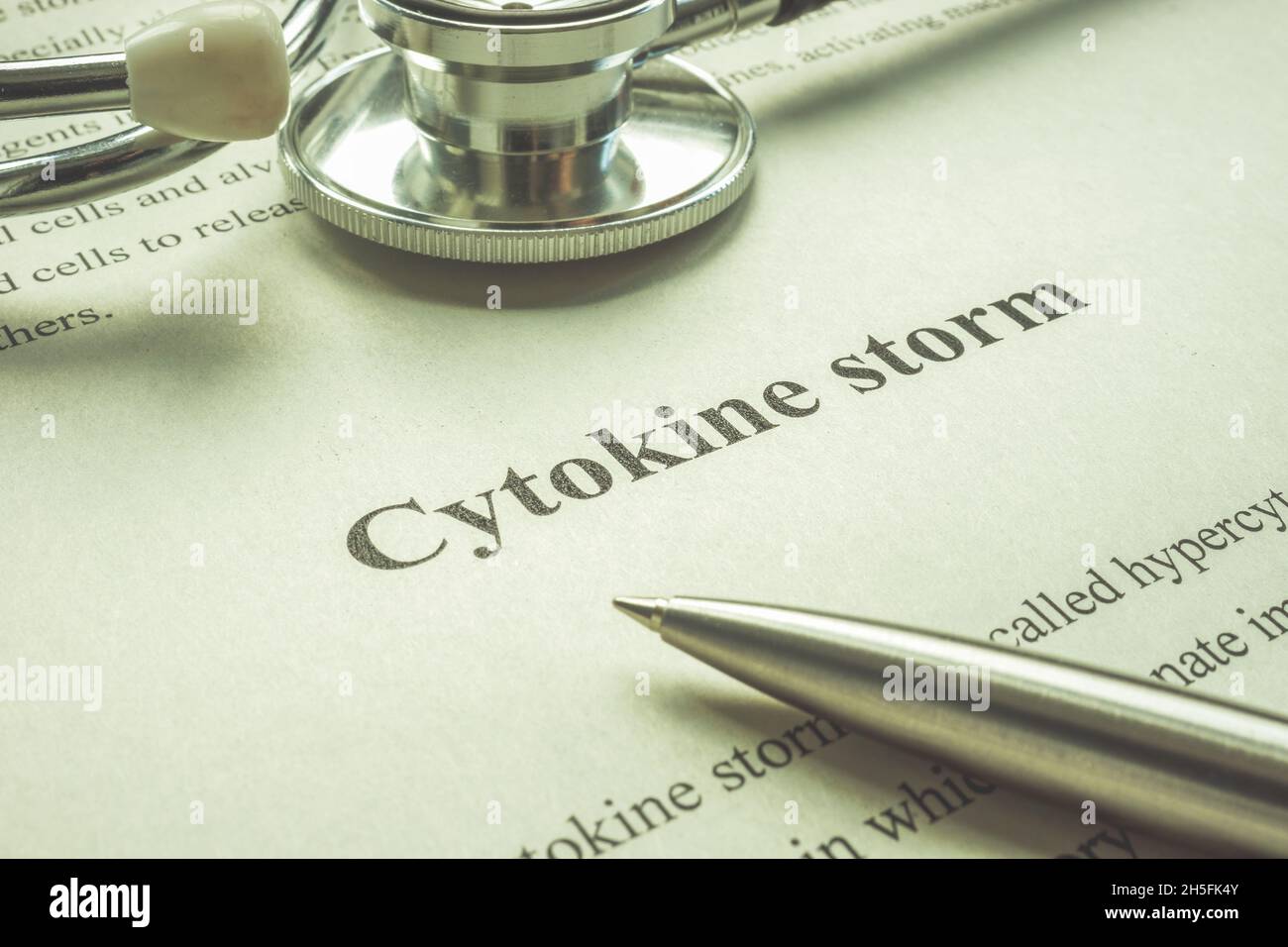 Page about cytokine storm, stethoscope and pen. Stock Photo