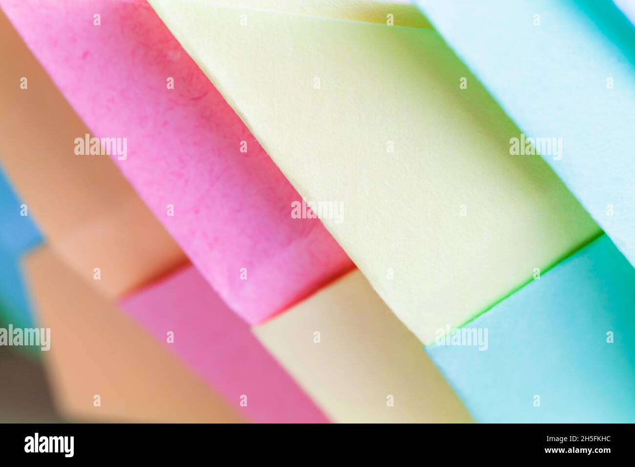 Colorful origami, background photo with selective soft focus, abstract parametric pattern made of paper sheets Stock Photo