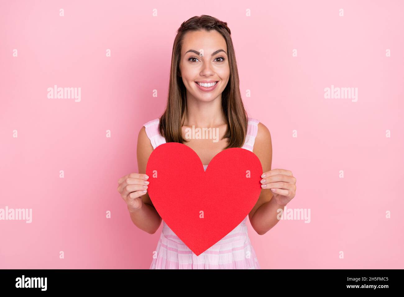 Photo of young cheerful girl hold large paper heart valentine day ...
