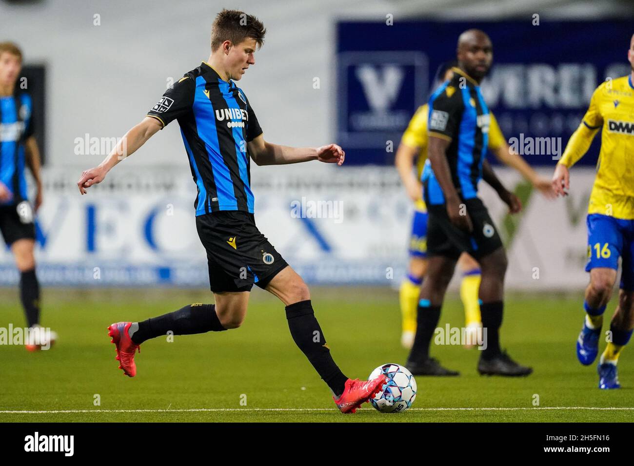 SINT TRUIDEN, BELGIUM - OCTOBER 30: Eduard Sobol of Club Brugge passes the  ball during the Jupiler Pro League match between Sint-Truidense VV and Club  Brugge KV at Stayen on October 30,