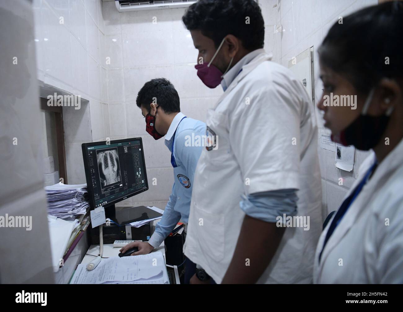 A radiographer prepares a patient for an X-ray in G. B. Pant hospital ...