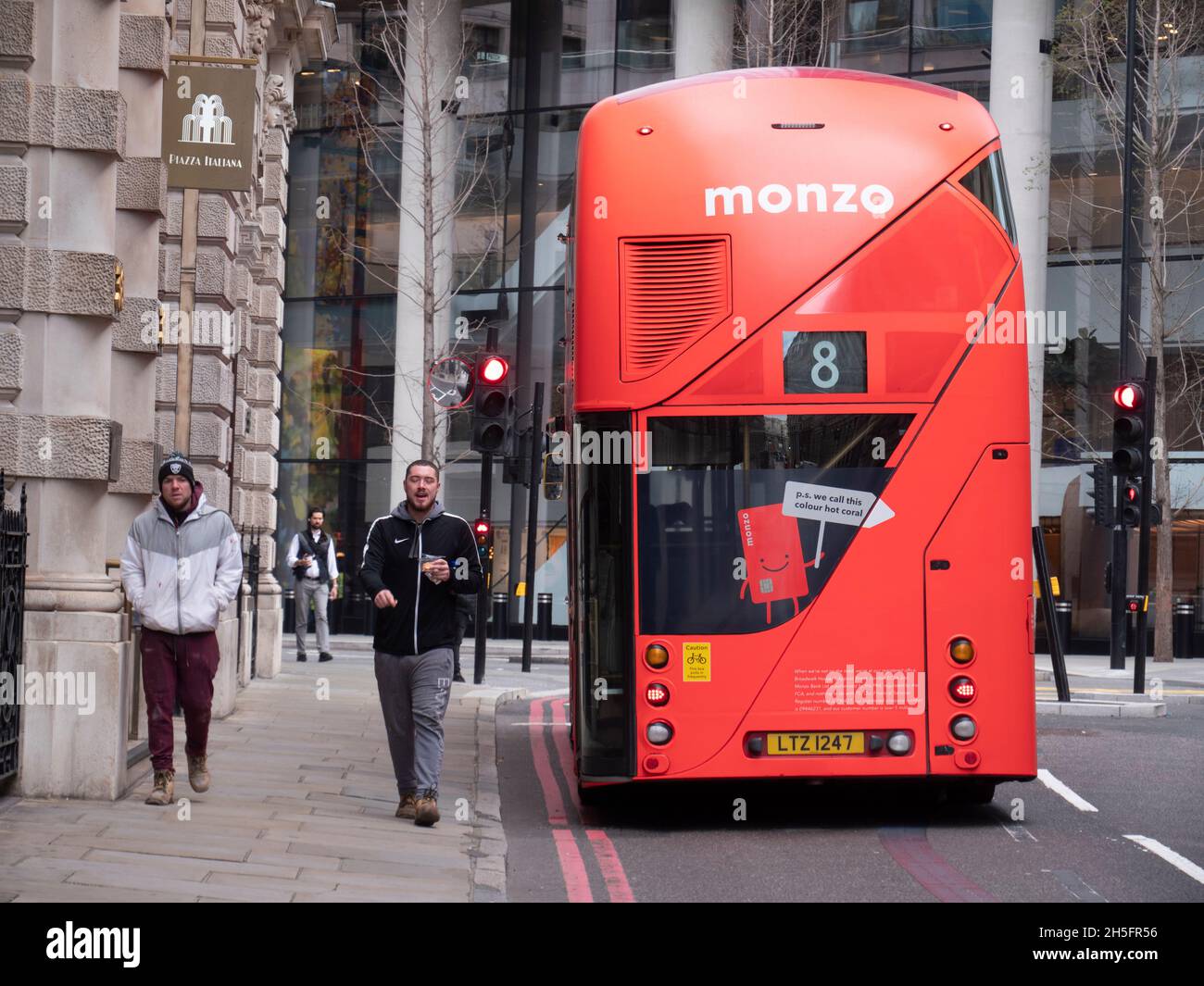 Bus in City of London with advertising for Monzo bank an online  app based challenger bank Stock Photo
