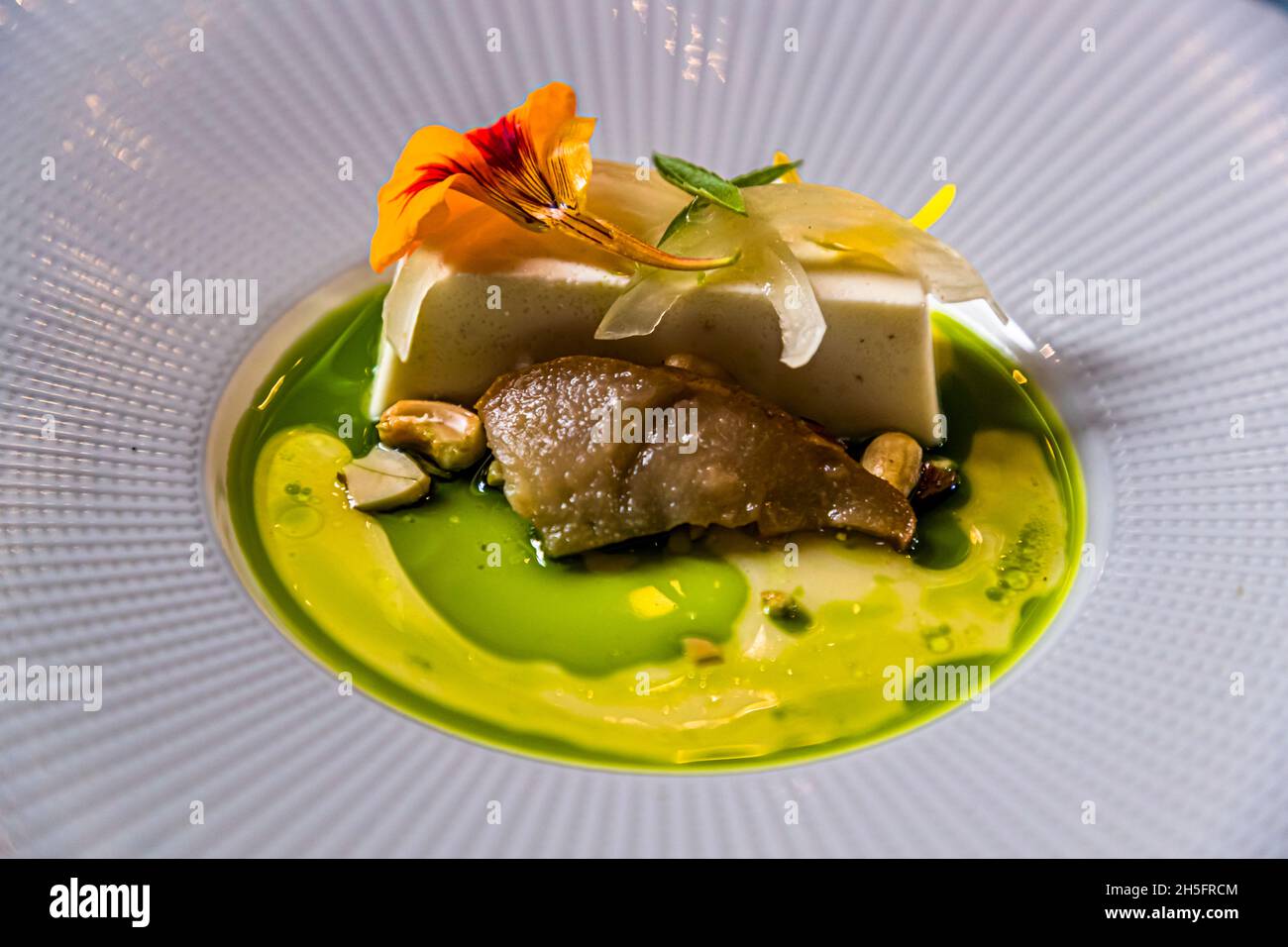 Goat cheese with basil oil. Lunch menu in the Arsenaal of Doesburg, Netherlands Stock Photo