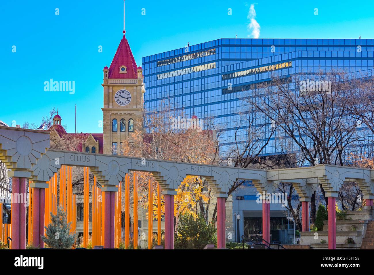 Heritage old City Hall Tower rises behind Olympic Plaza, Calgary, Alberta, Canada Stock Photo