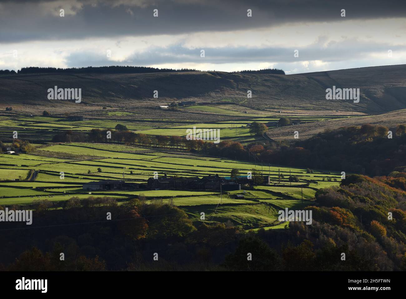 Hill farm near Stoodley Pike Monument on the moors of the upper Calder Valley and the market town of Todmorden. Stock Photo