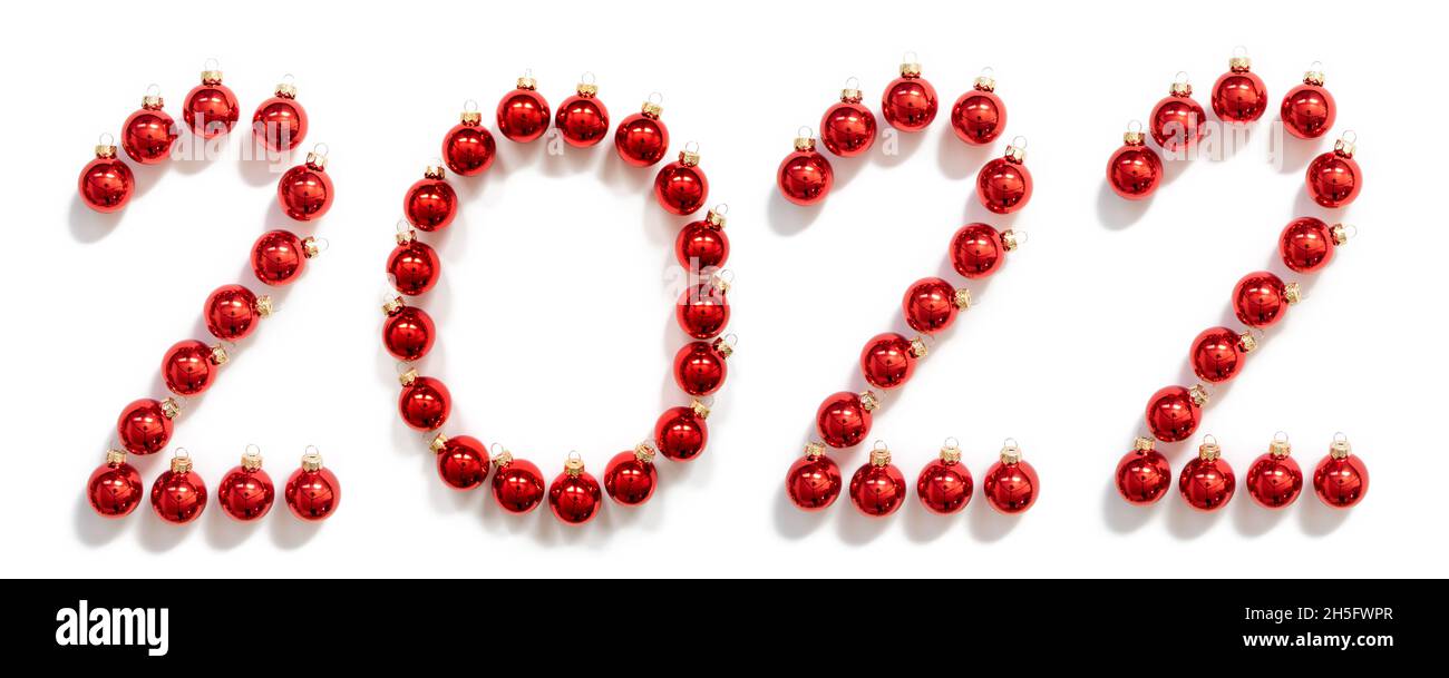 Red Christmas Ball Ornament Building Word 2022, White Background Stock Photo