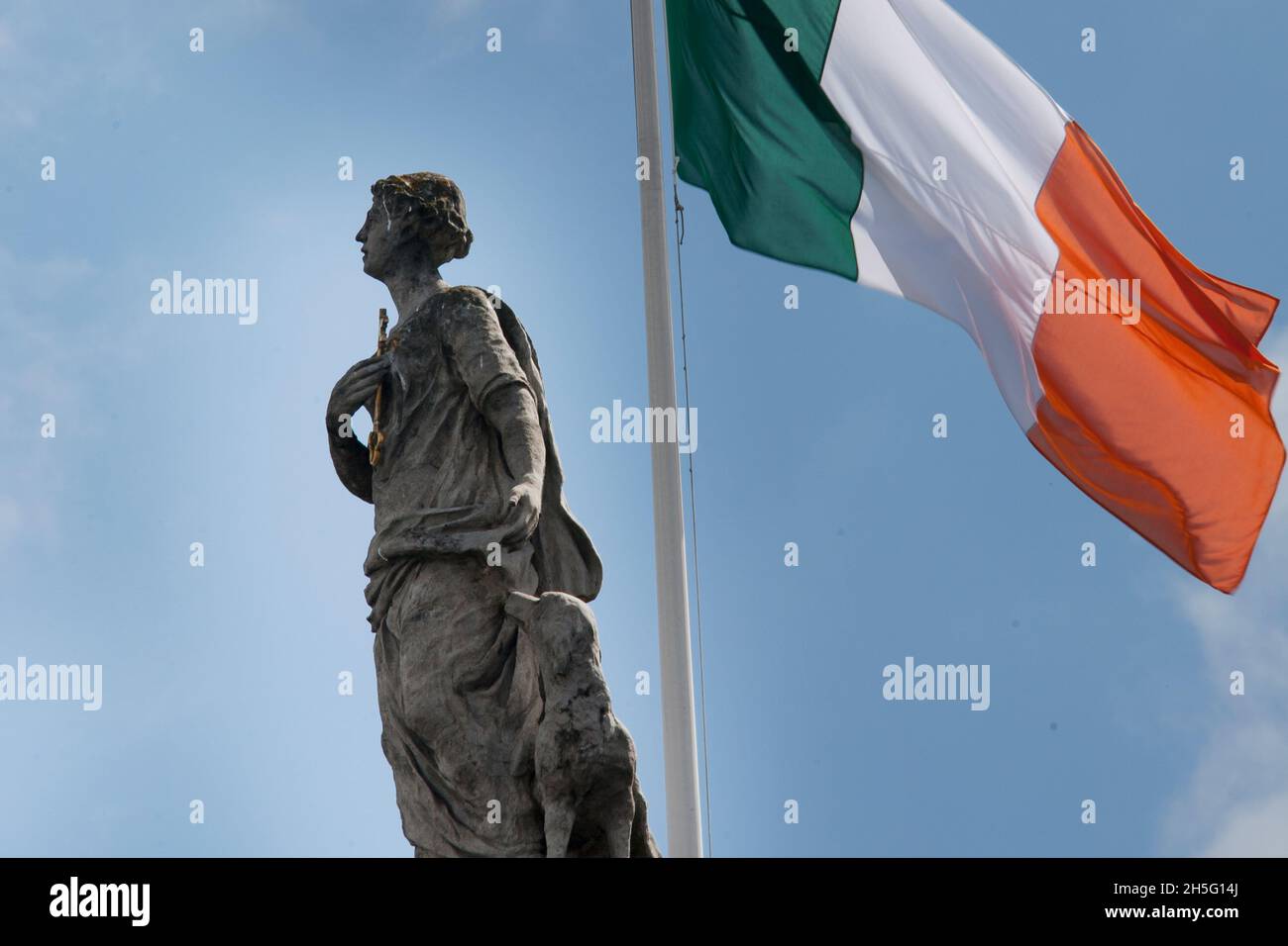 Statue of Fidelity with dog and the Irish tricolor on the GPO in Dublin Ireland Stock Photo