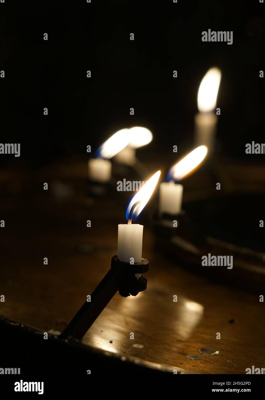 Candle in a dark room Stock Photo Alamy