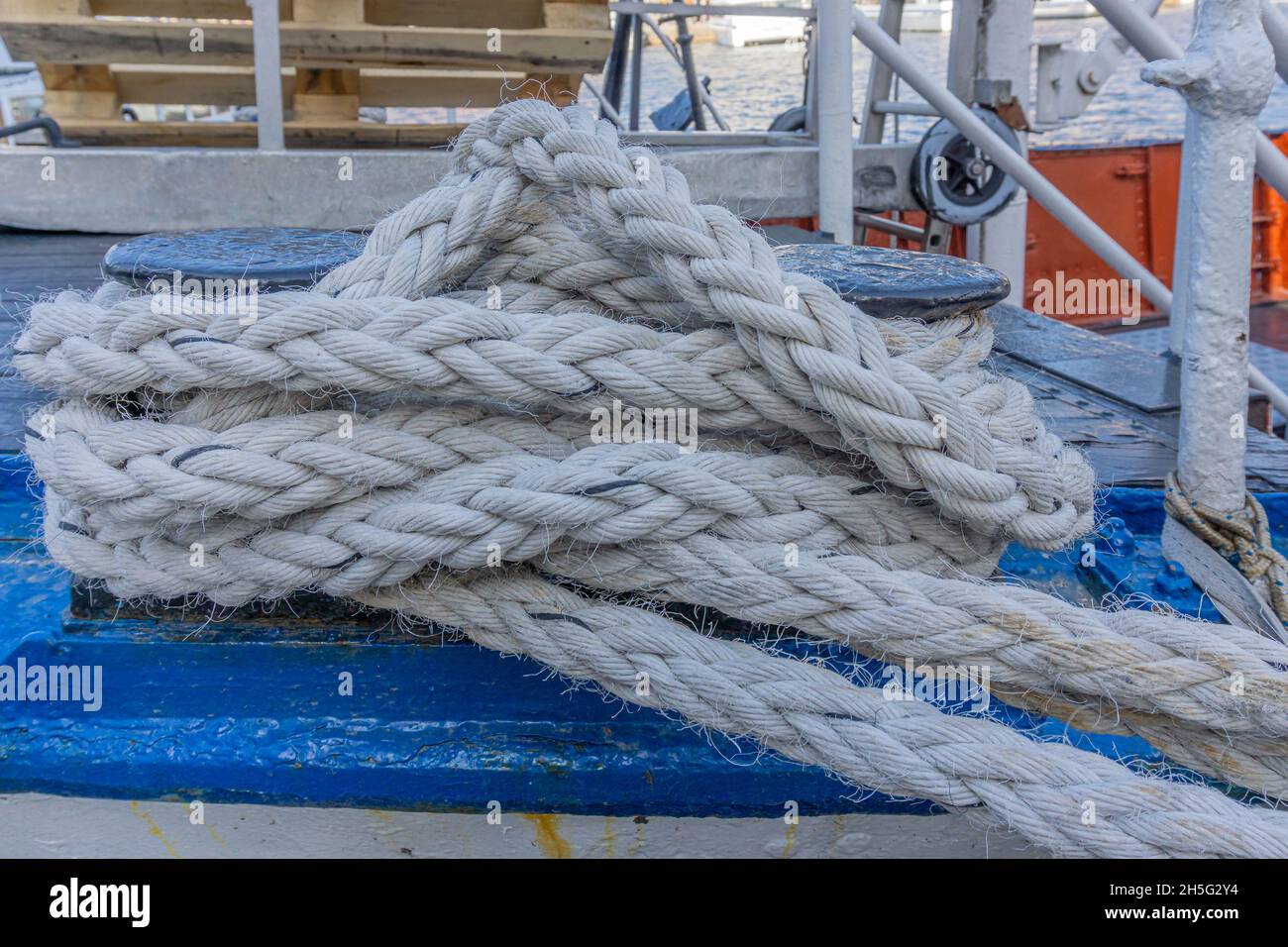 Stockholm, Sweden - April 17, 2021: Twined cream white rope on the ferries bollard Stock Photo