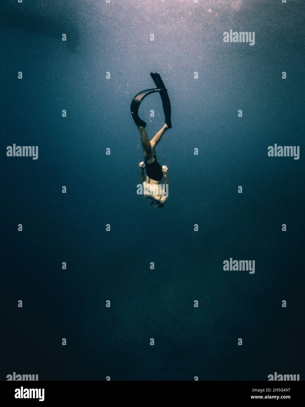 Person diving deep in Mediterranean sea Stock Photo - Alamy