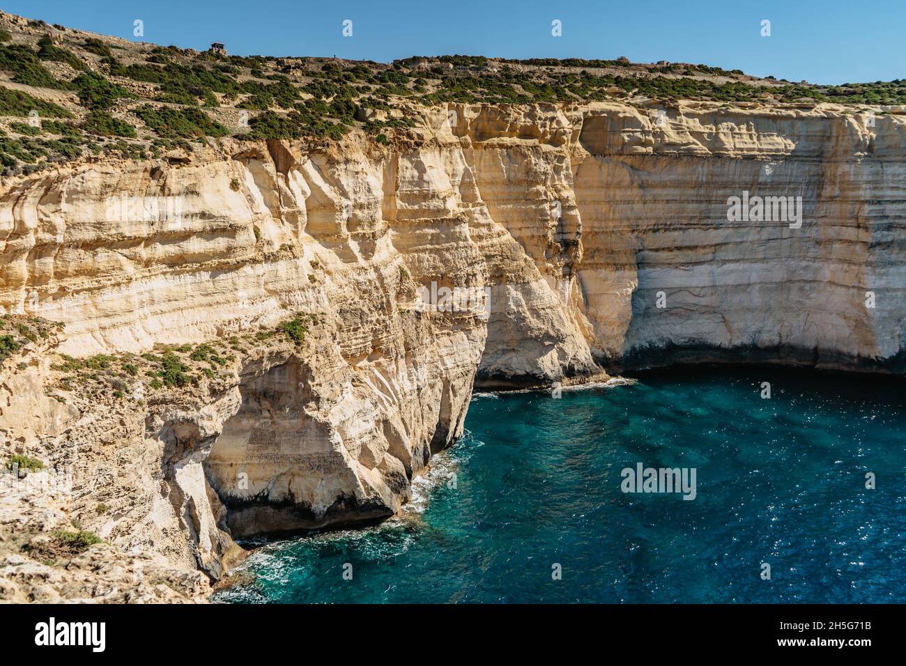 Rocky limestone coastline of Gozo island and Mediterranean Sea with turquoise blue water and caves.Great spot for hiking along Maltese coast.Popular Stock Photo