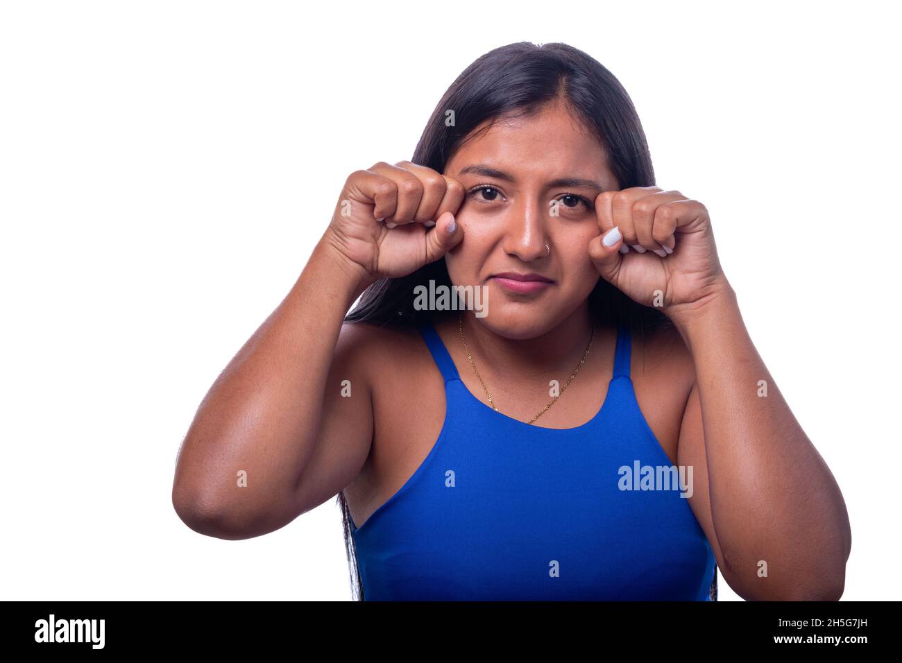 Dramatic woman making a crying face. Sad and crying black woman isolated on all white background. Stock Photo