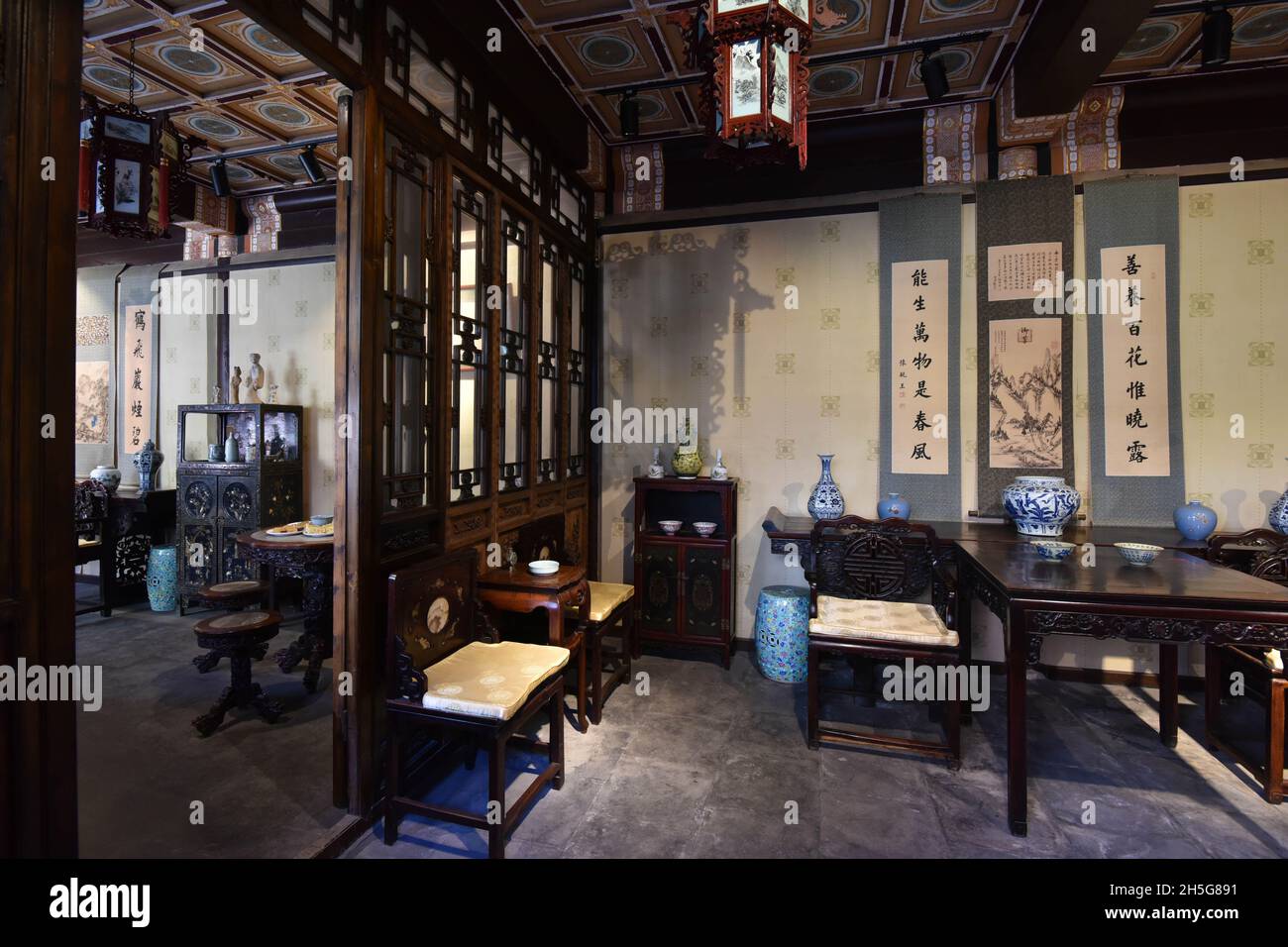 Tables and chairs are seen in the interior scene of Prince Gong's