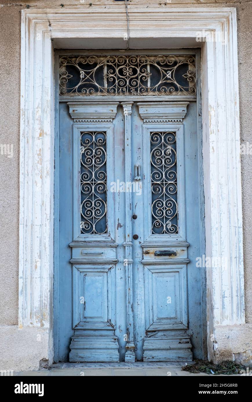 Faded blue wooden door Famagusta, Cyprus Stock Photo