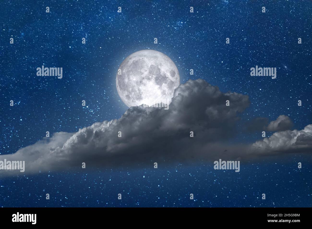 Night landscape full moon with clouds and stars in sky Stock Photo