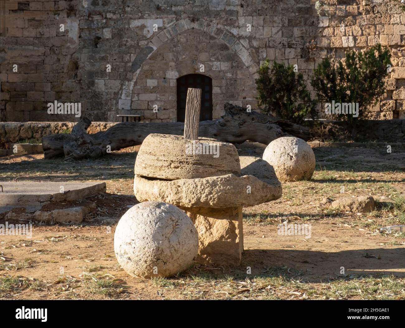 Historic stone olive press, Venetian palace, Famagusta, Cyprus. Stock Photo