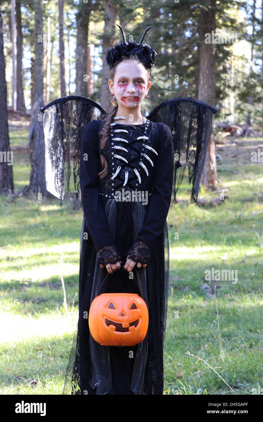 Child dressed up in Halloween costume for trick or treat Stock Photo