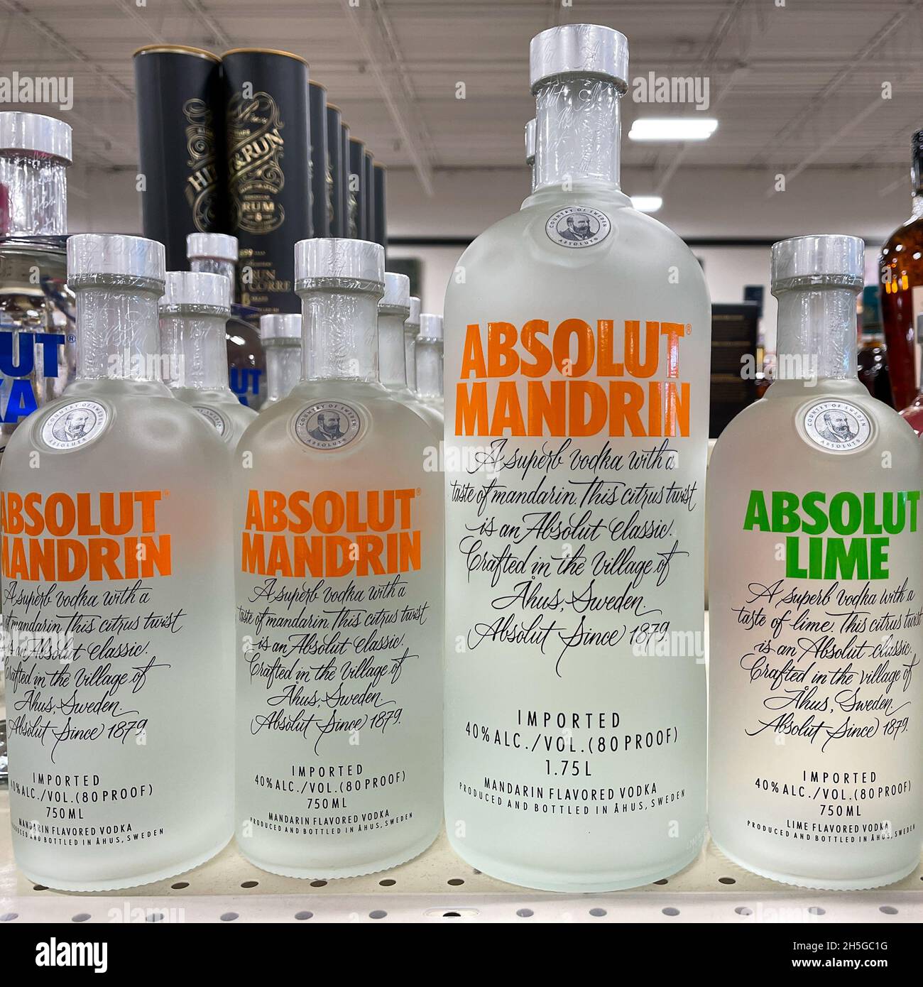 A display of bottles of  flavored Absolut Vodka with background bokeh at a Binneys liqour store in Springfield, Illinois. Stock Photo