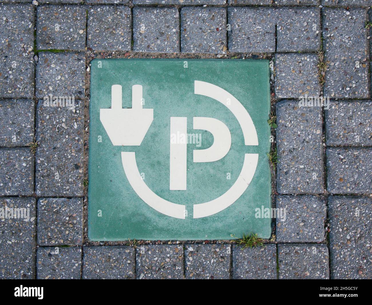 A sign on the ground showing parking with charge points for electric vehicles in Bloemendaal aan Zee in The Netherlands. Stock Photo