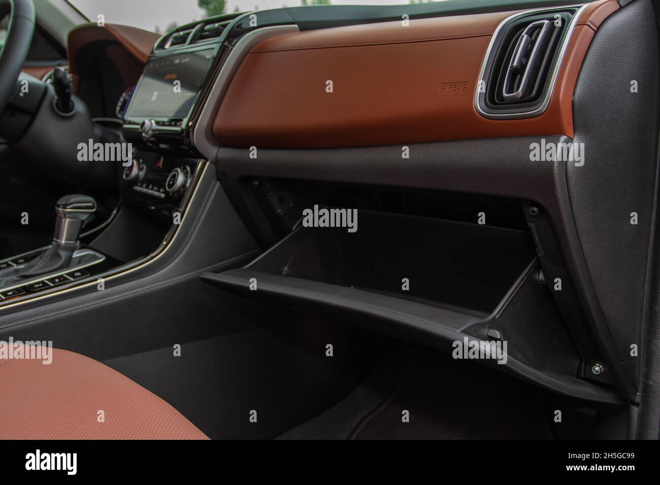 Opened car glove box compartment. Glove compartment of car Stock Photo