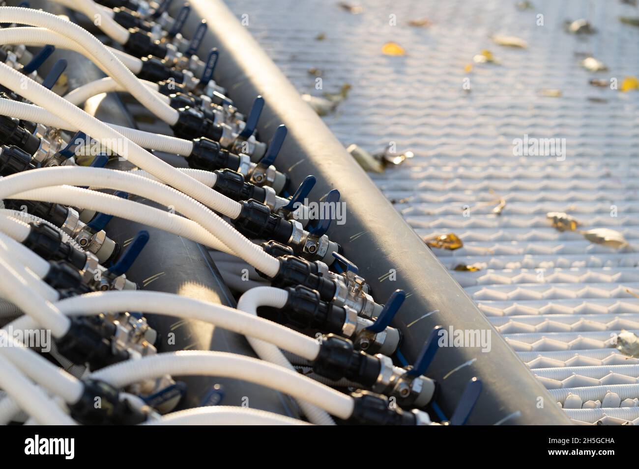 Preparing ice skating rink for outdoor activities pipelines for filling arena with water from