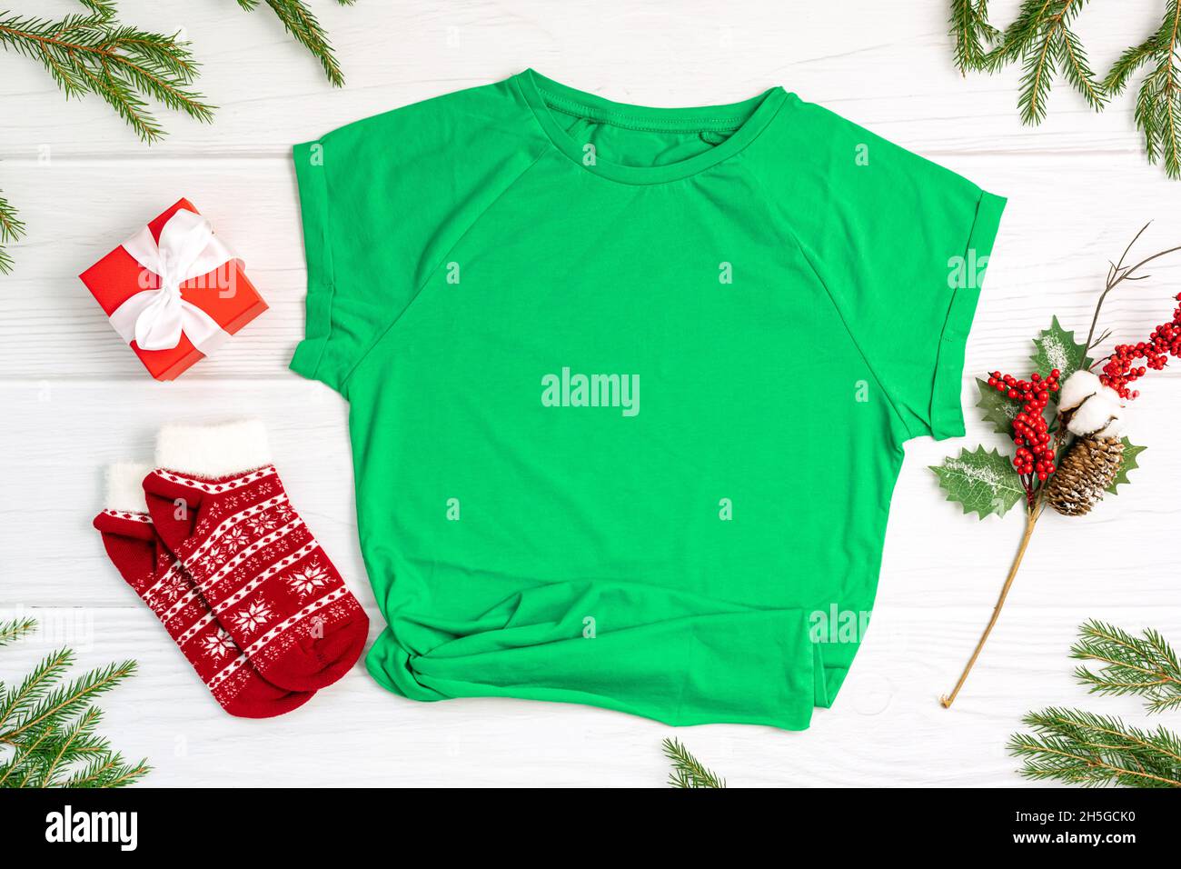 T-shirt socks and gift box with Christmas decor on white Stock Photo