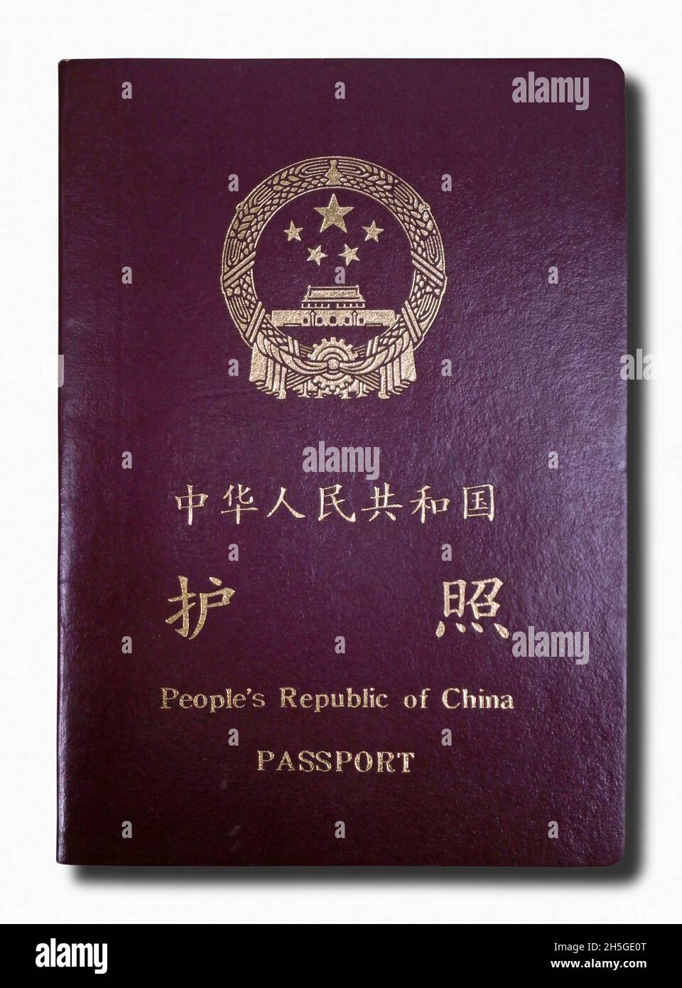 Close-up on a Chinese passport isolated on a white background. Stock Photo