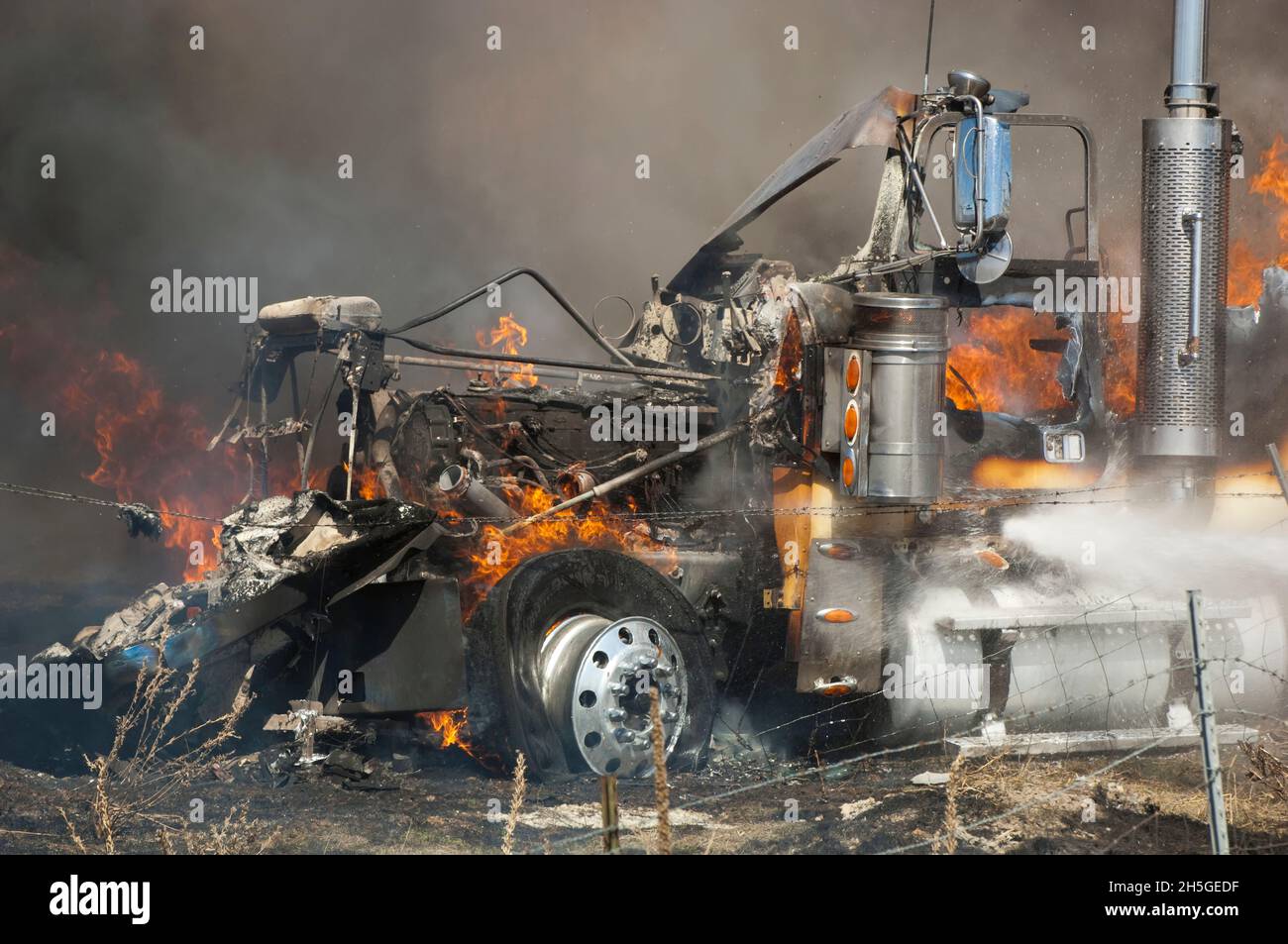 Close-up of a tractor-trailer truck on fire after an automobile accident; United States of America Stock Photo