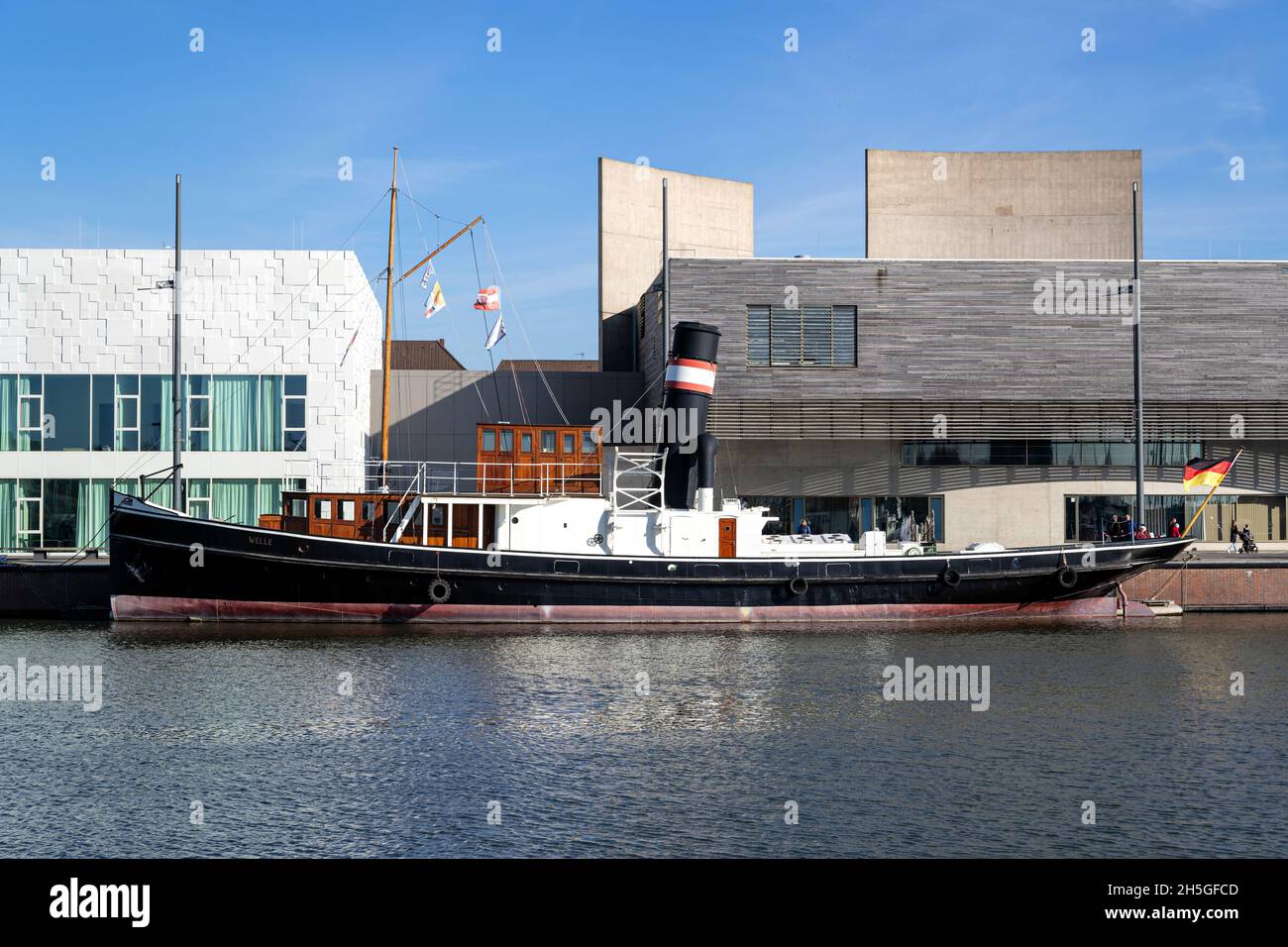 steamboat WELLE in the port of Bremerhaven in front of the German Emigration Center Stock Photo
