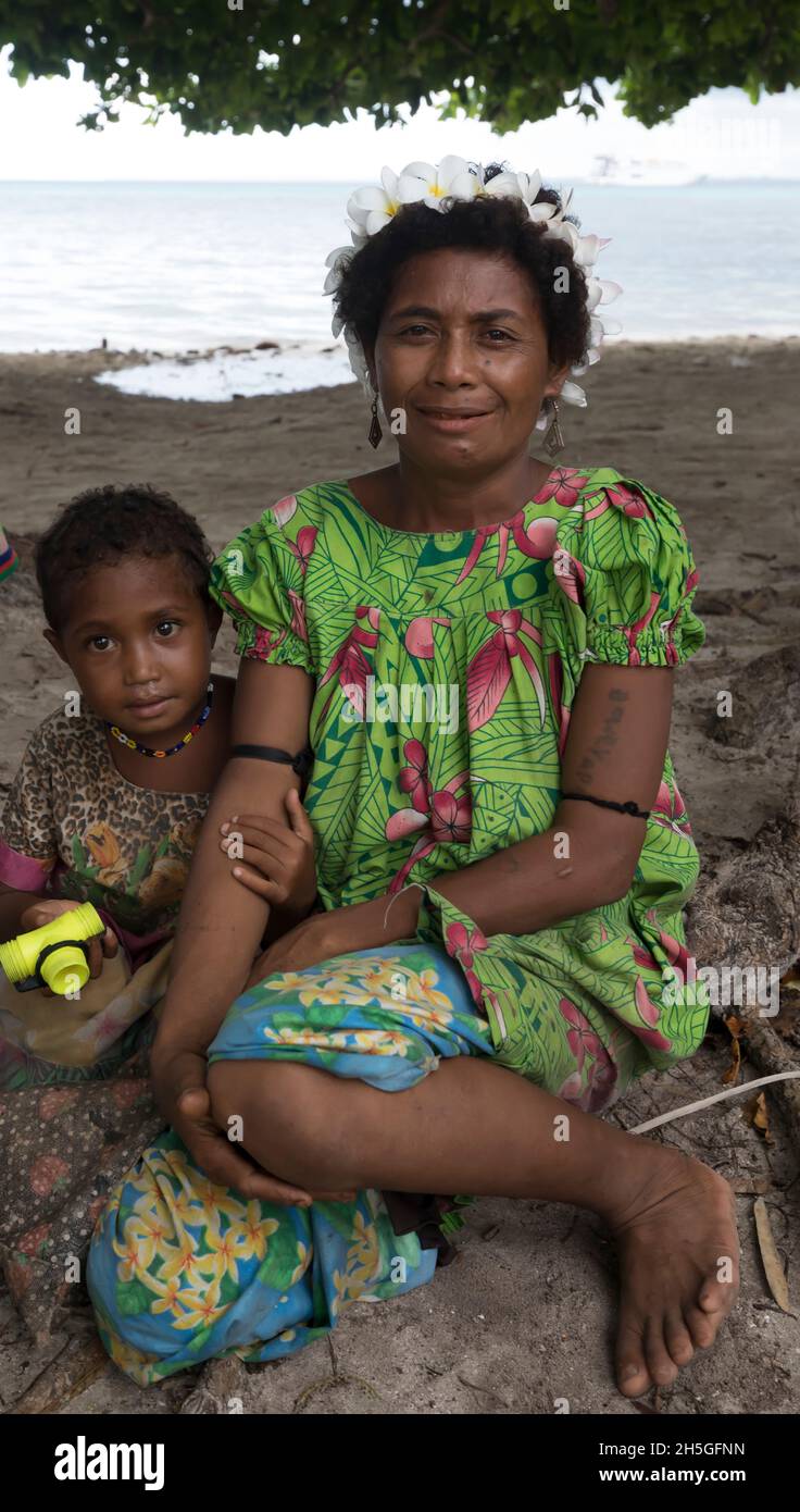 Mother and son on Kuiawa Island in the Trobriand Islands, Papua New Guinea; Kuiawa, Trobriand Islands, Papua New Guinea Stock Photo