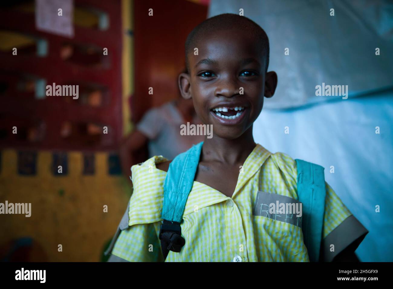 A young boy smiles in an orphanage. Stock Photo