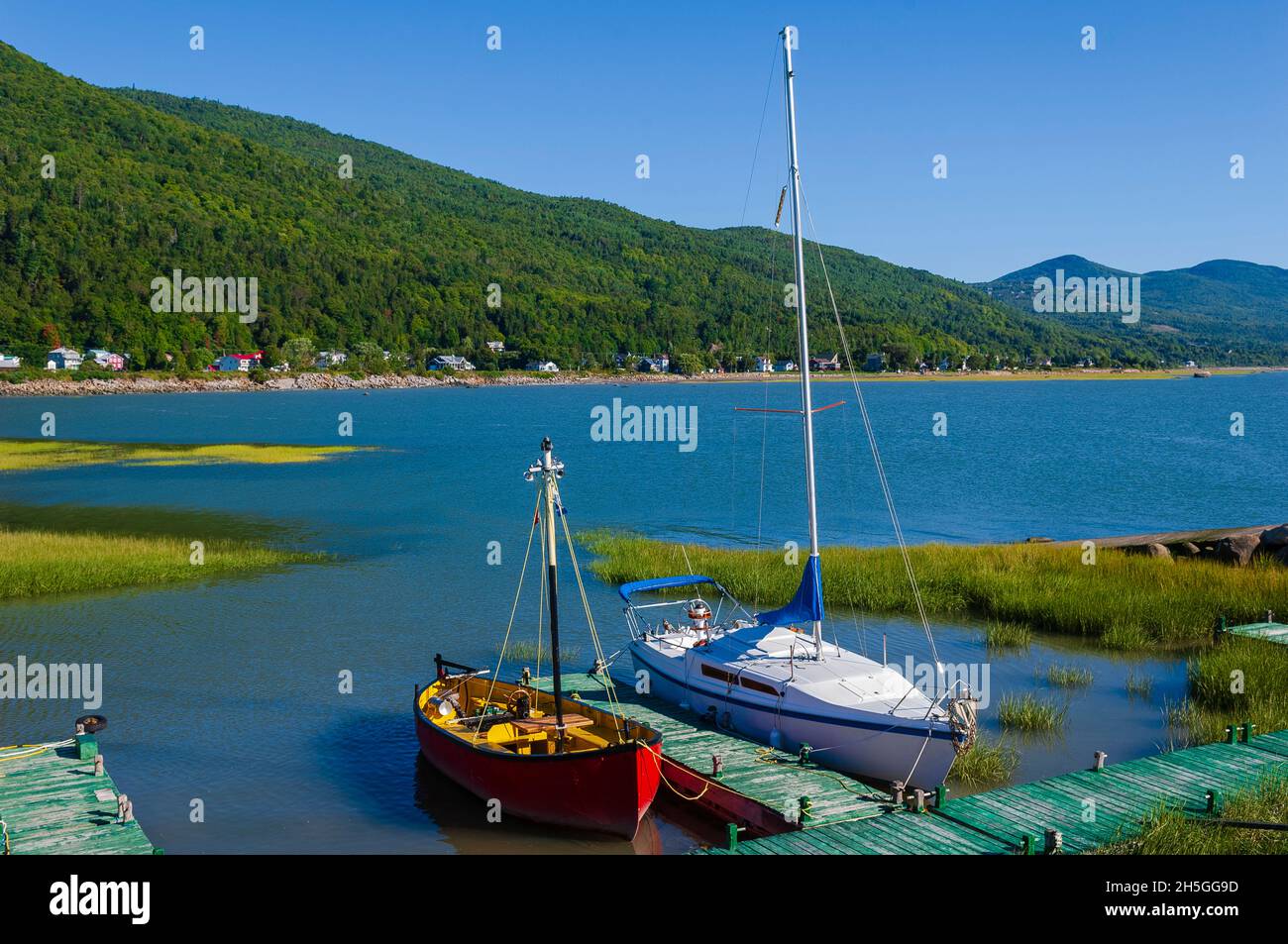 Sailboats moored in a little harbour on the Saint Lawrence River at Le