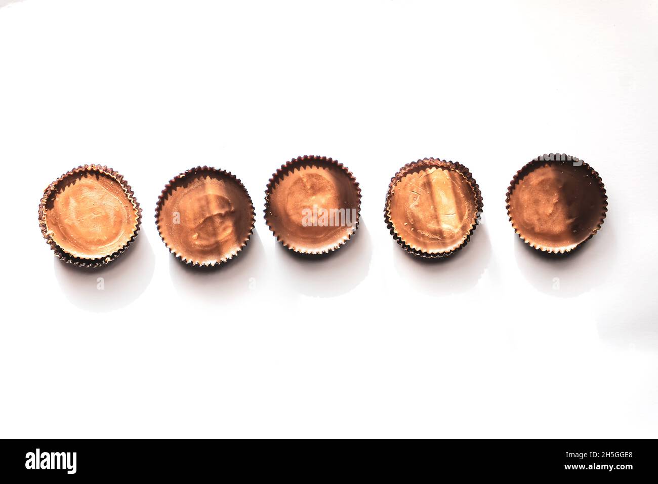 Peanut butter filled candy with chocolate frosting isolated on white background Stock Photo