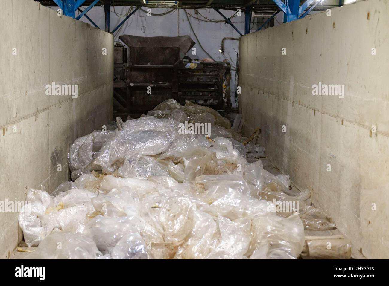 The sorting center selects transparent packages. The garbage plant separates waste by fractions and types. Stock Photo