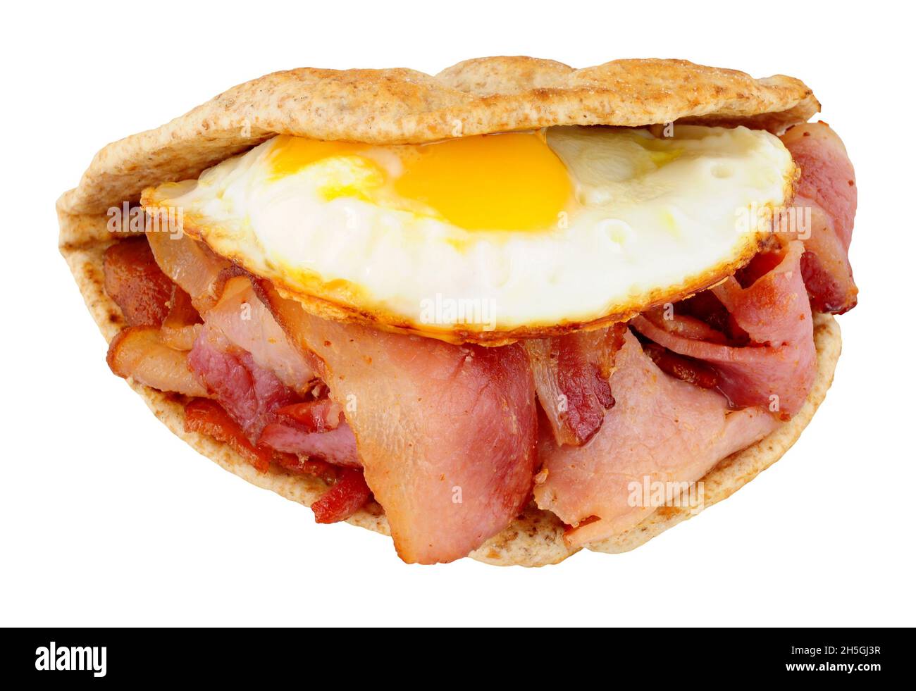 Fried egg and bacon flatbread sandwich isolated on a white background Stock Photo