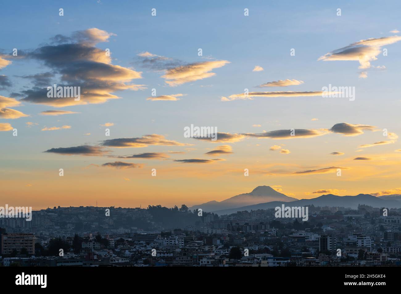 Quito city at sunrise with Cayambe volcano, Ecuador Stock Photo Alamy