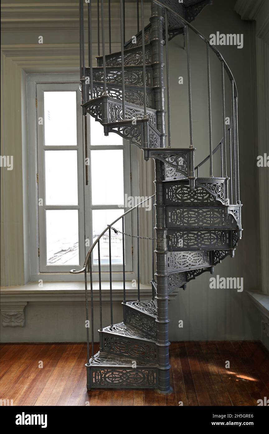 A Victorian era wrought cast iron spiral staircase in a restored ...