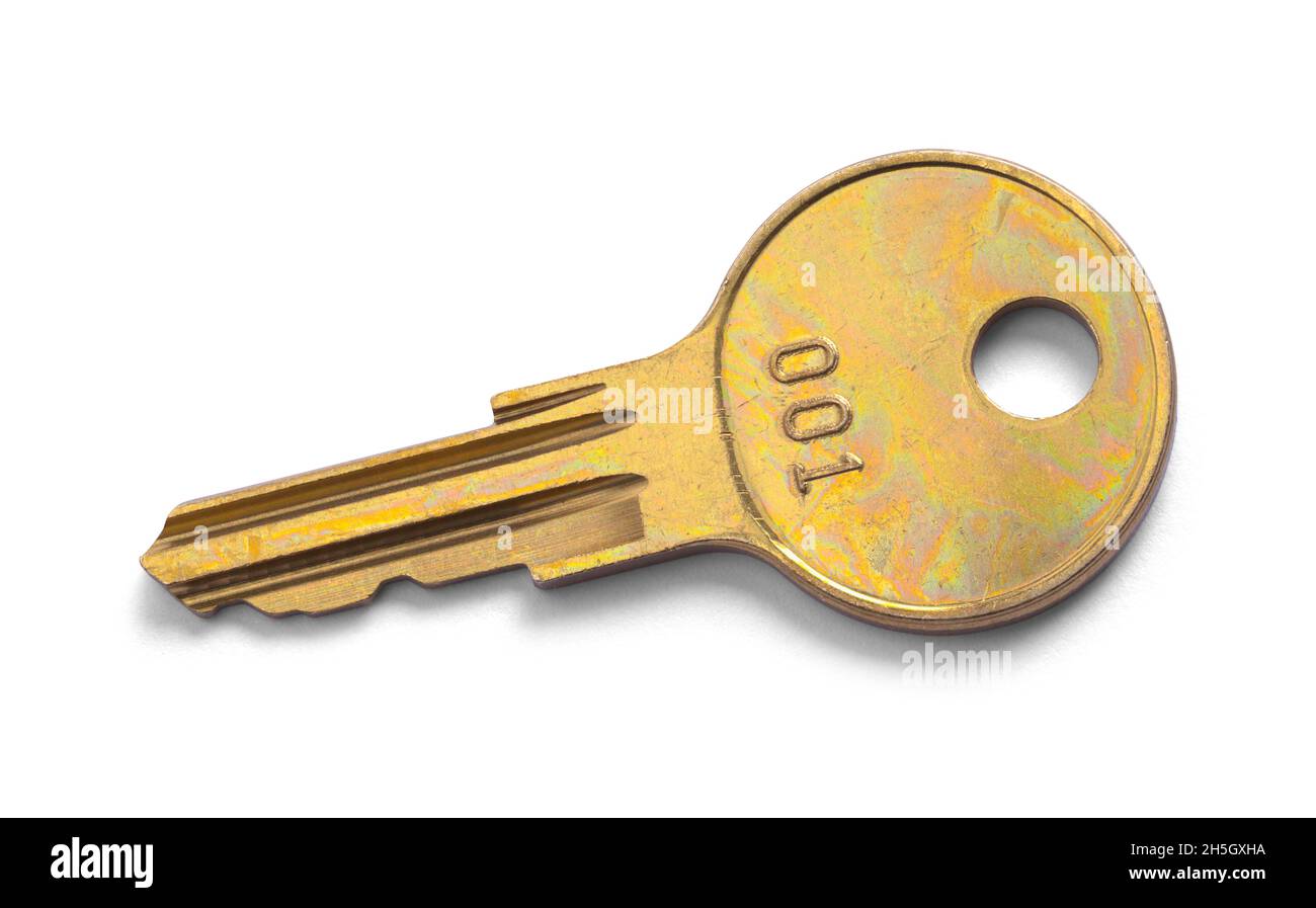 Worn Brass Key With Number Cut Out On White. Stock Photo