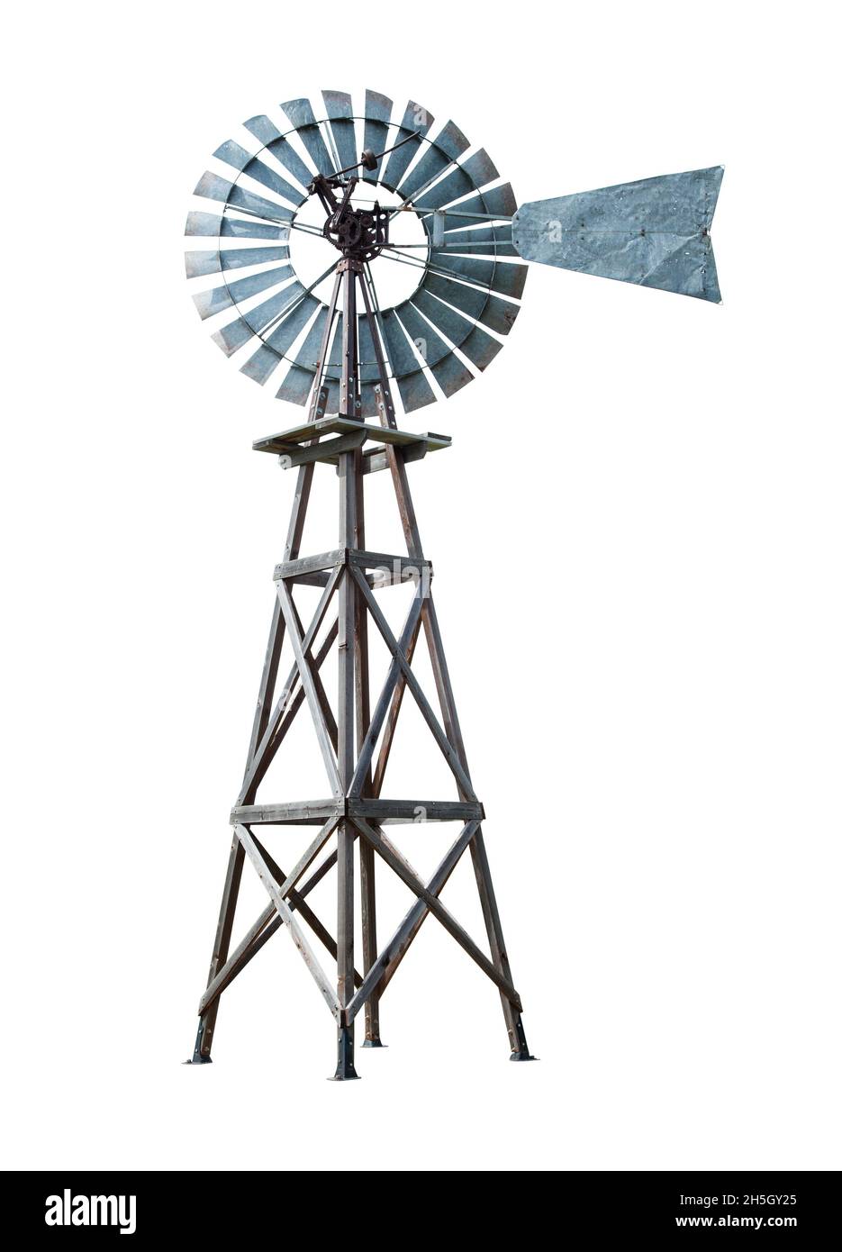Old Farm Windmill Water Pump Turbine Cut Out on White. Stock Photo