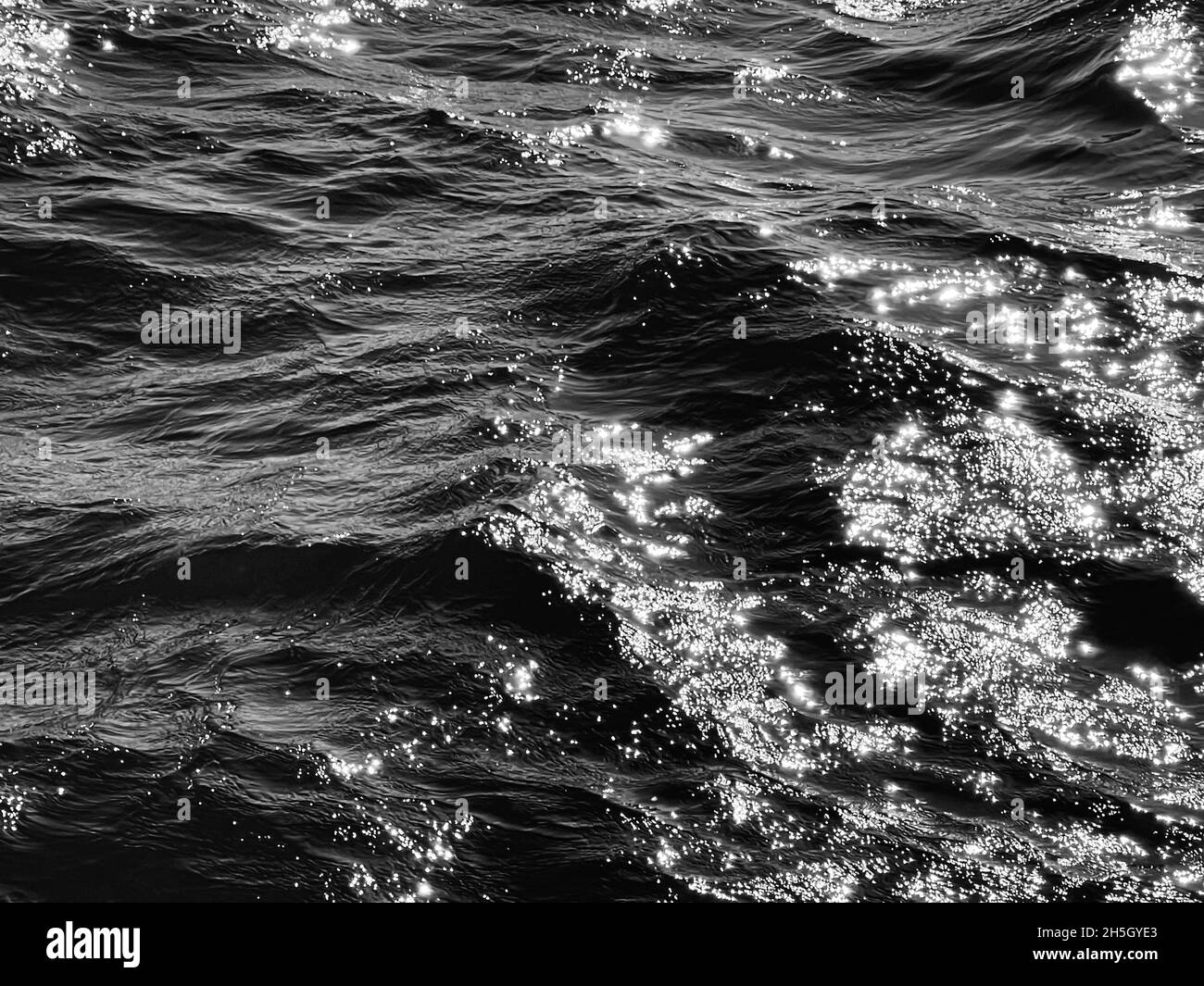 Sea, texture and coastal nature concept. Ocean water as black and white ...