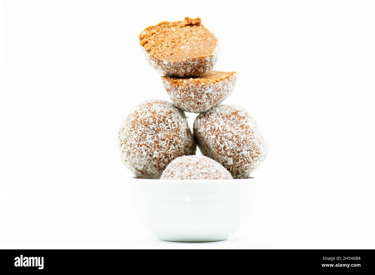 Detailed close up of delicious coconut covered rum balls Stock Photo