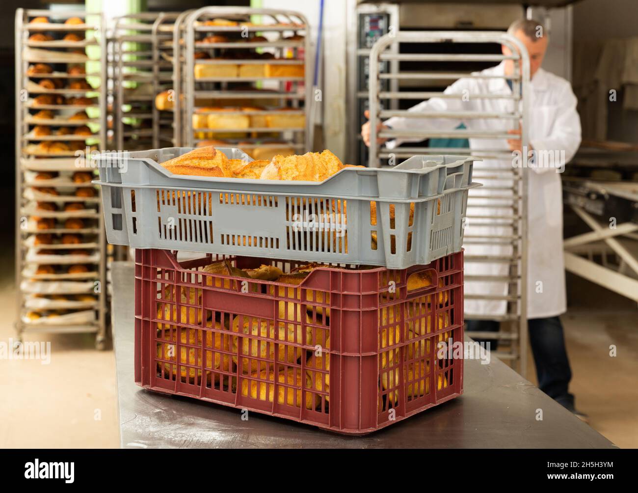 Box with fresh bread in bakery Stock Photo