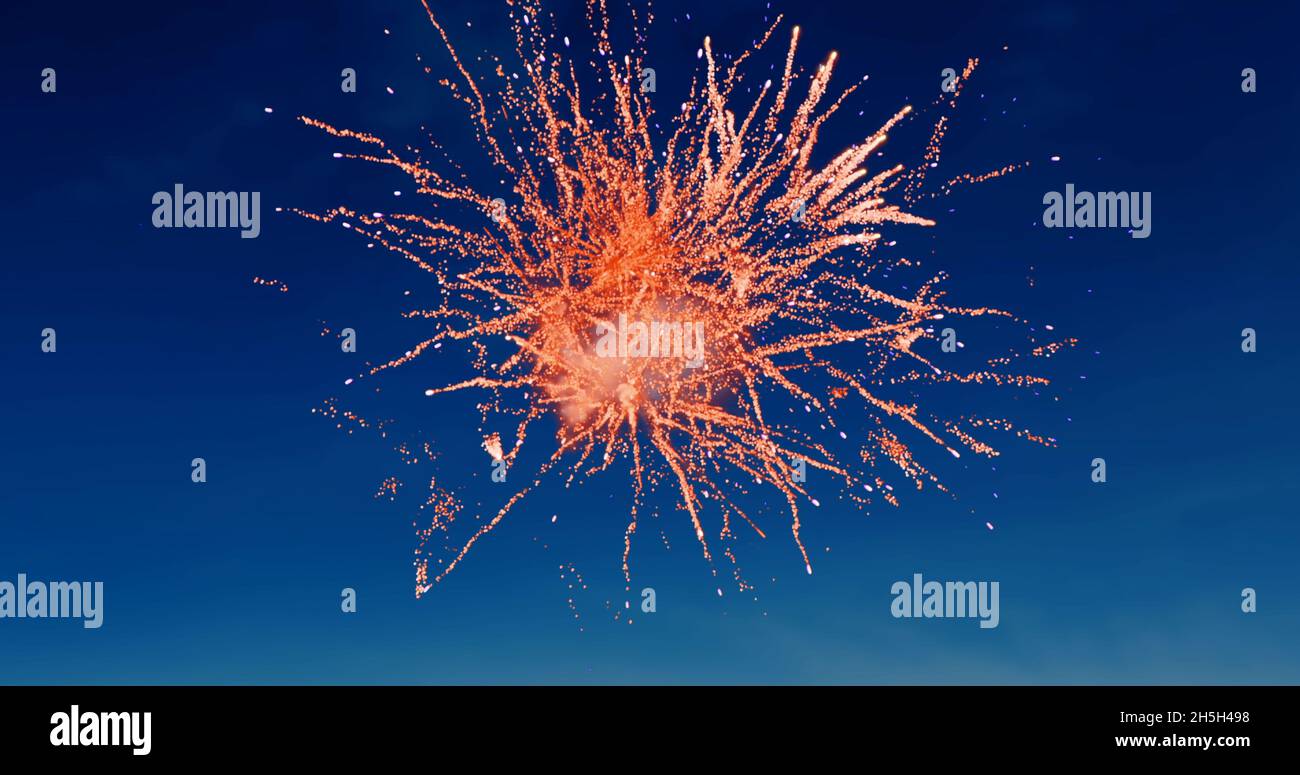 Digital image of red fireworks exploding in the blue sky Stock Photo