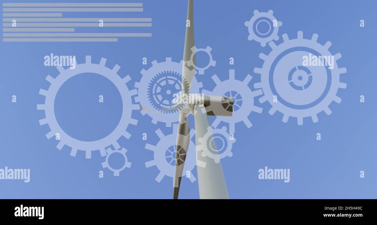 Panning view of wind turbines with moving white gear wheels icon as background Stock Photo