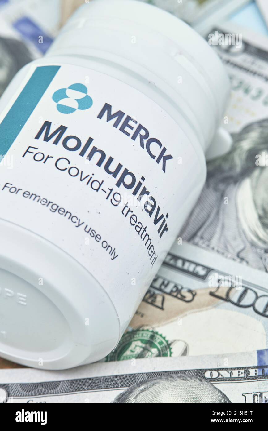 Tashkent, Uzbekistan - November 9, 2021: US dollars and Molnupiravir