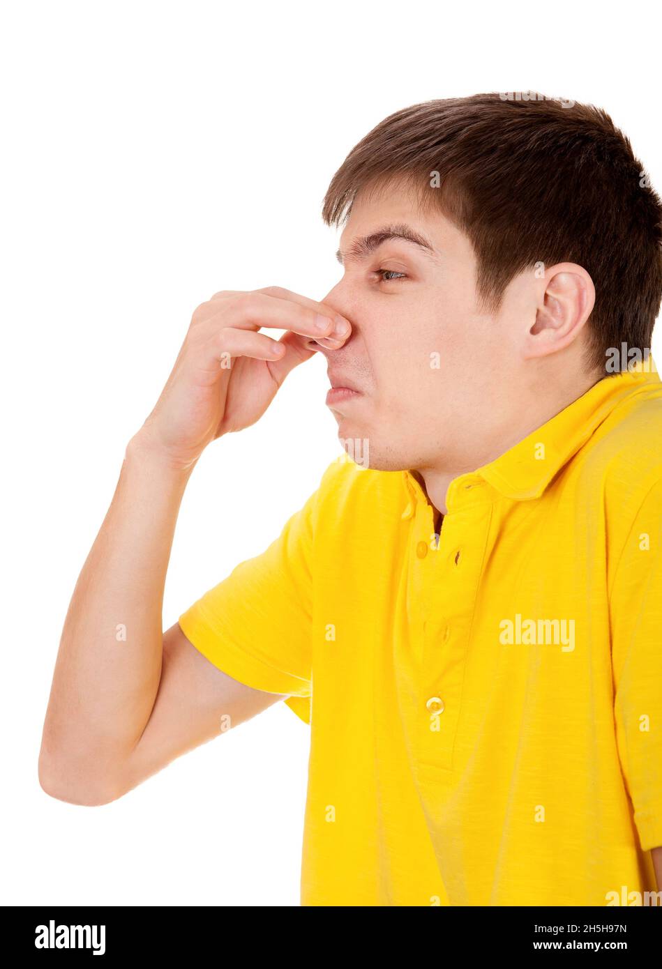 Displeased Young Man feel a Stink Isolated on the White Background Stock Photo