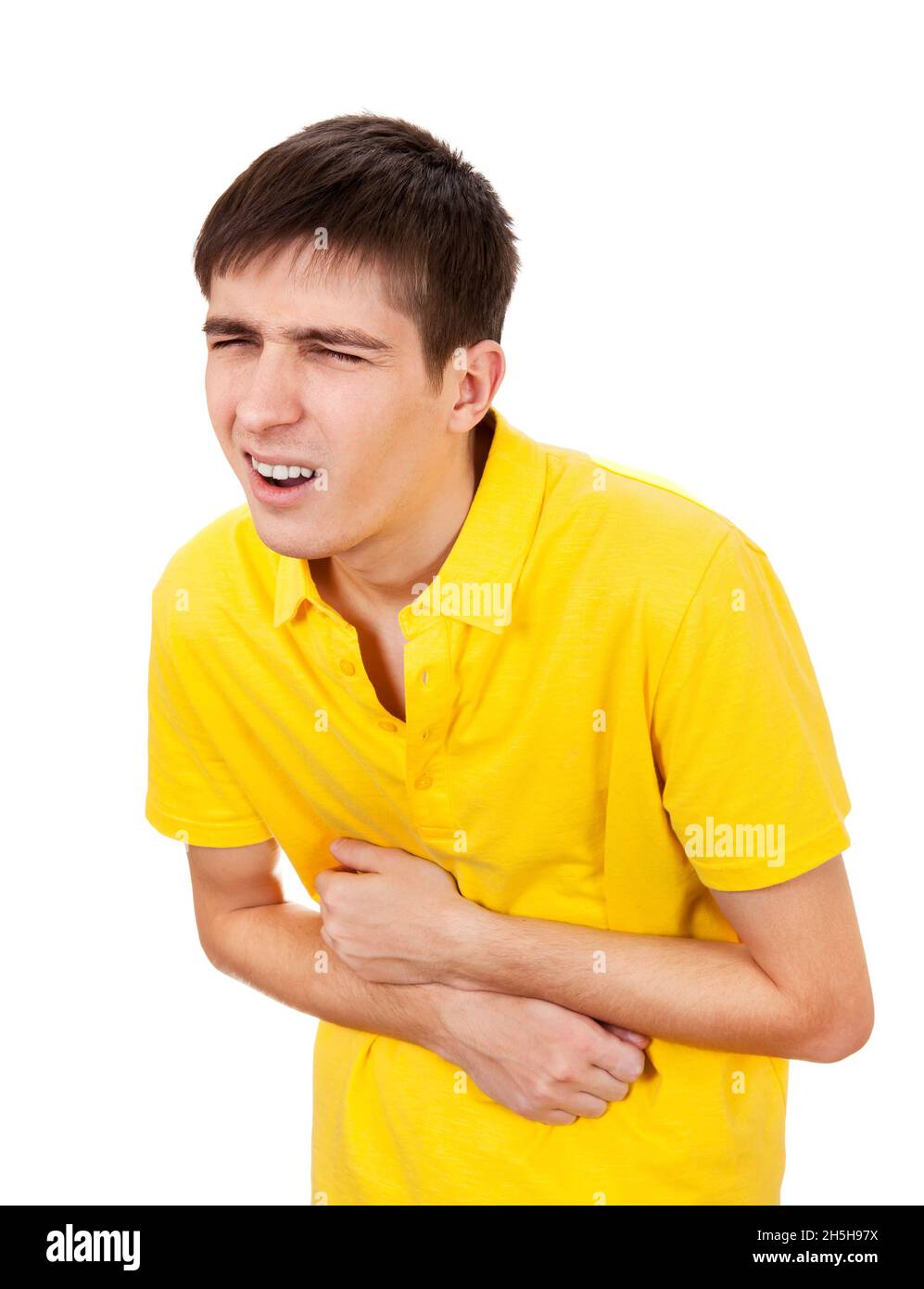 Young Man feels Stomachache Isolated on the White Background Stock Photo