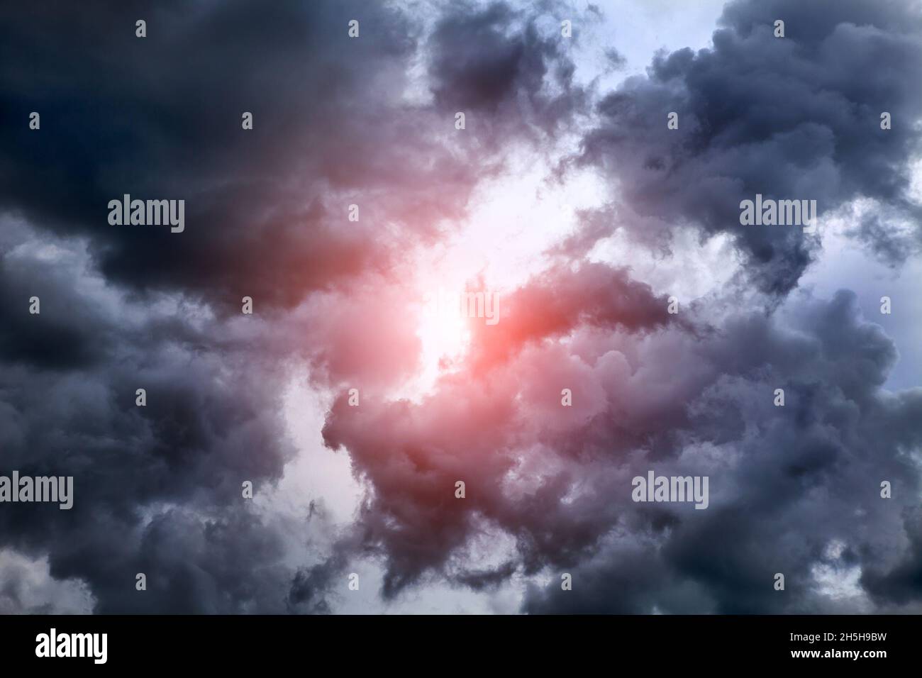 Light in the Dark and Dramatic Storm Clouds Stock Photo - Alamy