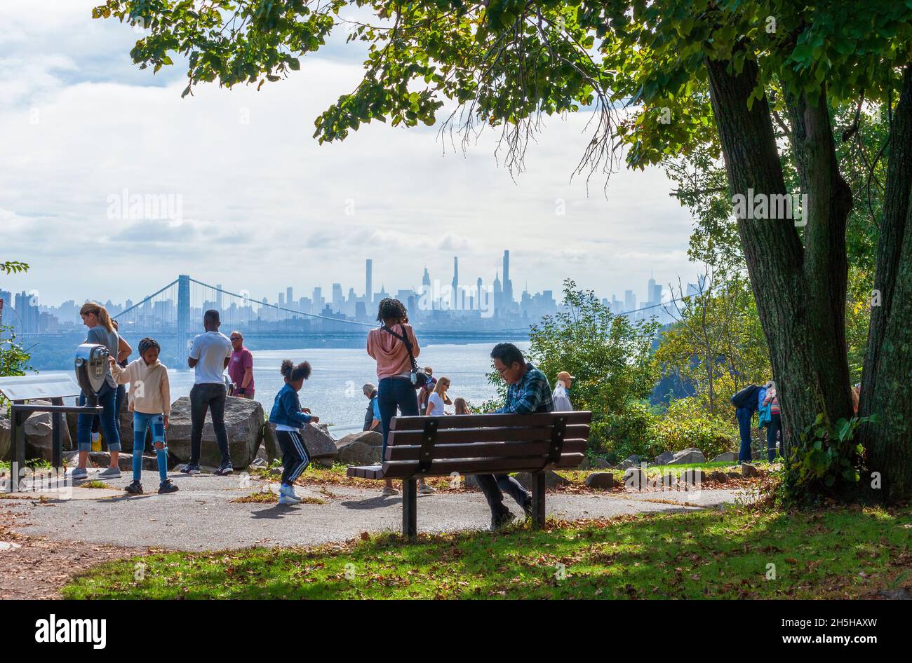 Tourists enjoying the view of the George Washington Bridge and the ...